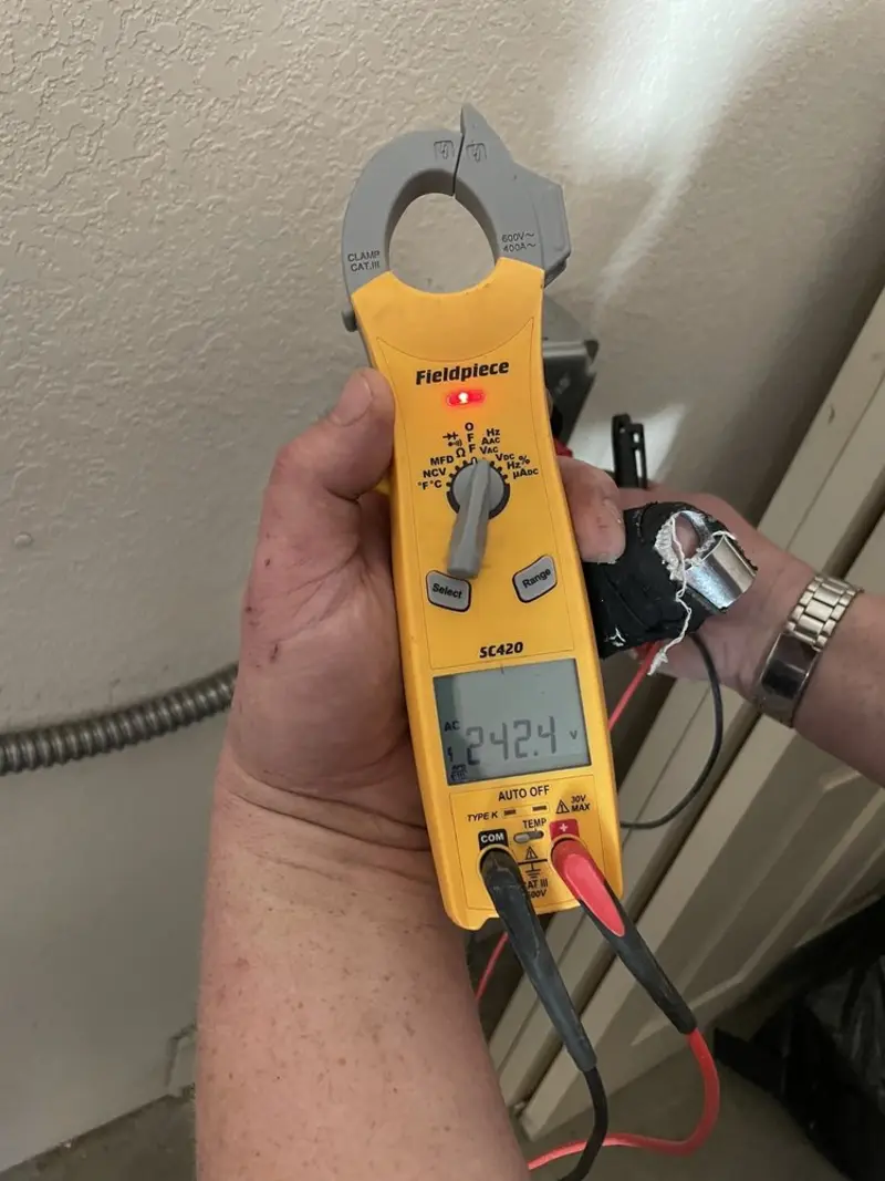 Voltage testing with clamp meter during Electrical Installation Services in Brighton